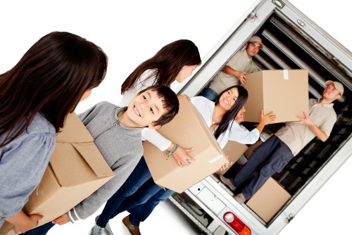 Professional movers handling flat removals in Camberwell on a residential street