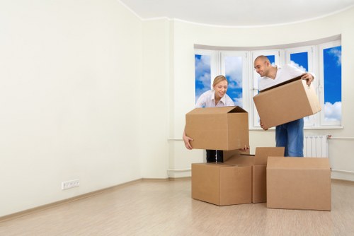 Careful furniture handling at a property entrance