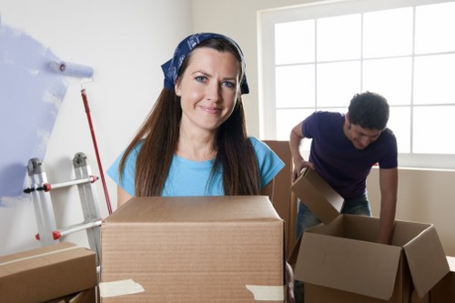 Commercial relocation day with labelled boxes and office equipment