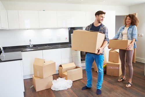 Team using safe lifting techniques during a move