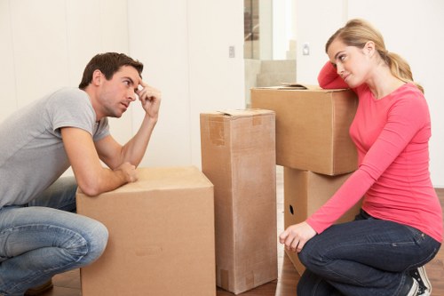 Removal professionals transporting furniture on moving day in Camberwell
