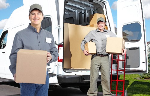 Loading commercial items into a removals vehicle in a South London street
