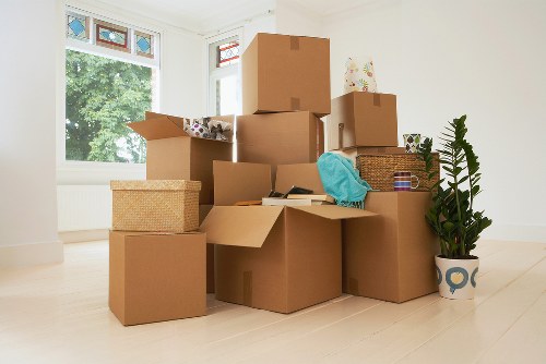 Local movers assisting with furniture in a Camberwell home