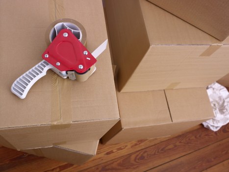 Moving team packing office equipment for relocation in Camberwell